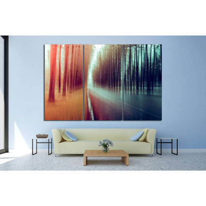 Warm to Cool Forest Blur Wall Decor - Modern Artistic ArtworkThis canvas print features an artistic interpretation of a forest scene, where the technique of motion blur creates a smooth transition from warm autumnal tones to cool, serene blues. The image