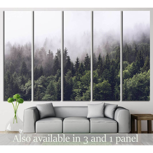 Misty Forest Panorama: Triptych Canvas ArtThis canvas print triptych presents a lush evergreen forest veiled in fog, offering a sense of mystery and natural beauty. As wall decor, it creates a continuous panoramic view, making it an impactful wall art cho