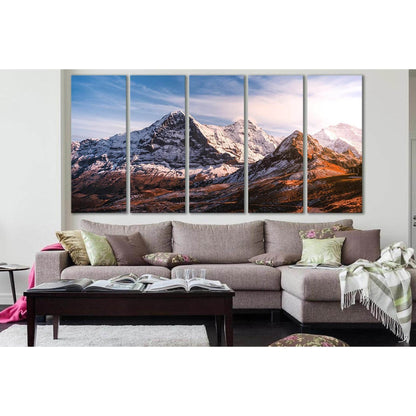 Rustic Mountain Canvas Art: A Panoramic Wall Decor StatementThis canvas print captures the rugged beauty of snow-capped mountains under a serene sky, ideal for adding a natural touch to corporate offices or living room wall decor. The warm tones and textu