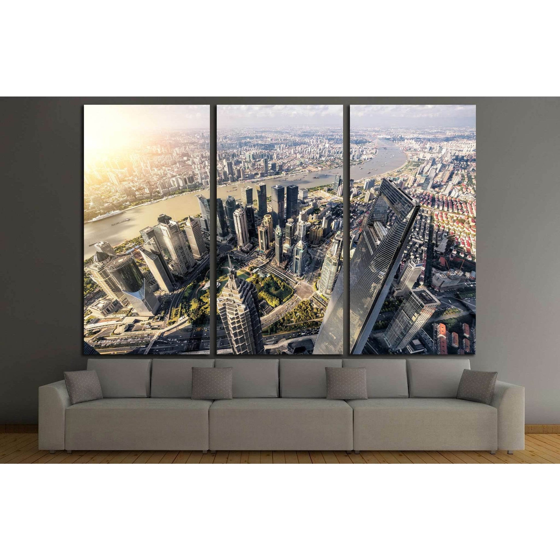 Aerial Shanghai Lujiazui skyline triptych canvas print above sofa in a modern living room