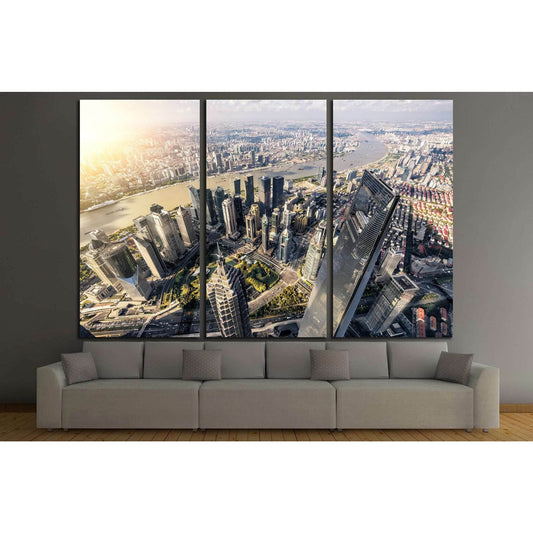 Aerial Shanghai Lujiazui skyline triptych canvas print above sofa in a modern living room