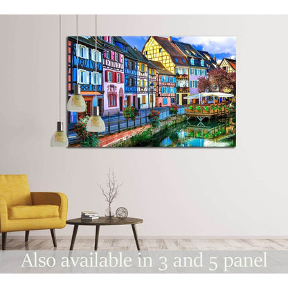 Colorful Colmar canal houses canvas print displayed above a sofa in a modern living room