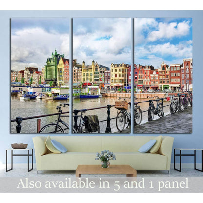Amsterdam canal houses triptych canvas print with bicycles along the waterfront above a sofa
