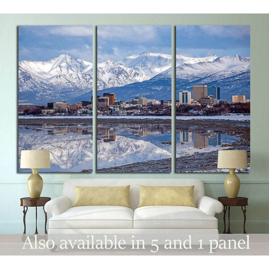 Anchorage skyline triptych canvas print with snowy mountains and city reflection above a sofa