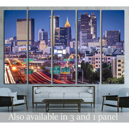Atlanta skyline canvas print with twilight rush hour traffic above a sofa in a modern living room