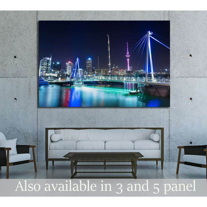 Auckland skyline canvas print with Sky Tower at night displayed above sofa in a modern living room