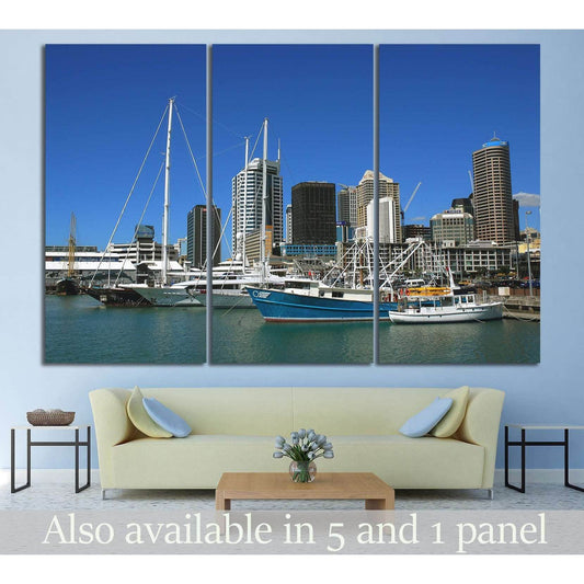 Auckland harbor skyline canvas print with sailboats, shown above a sofa in a modern living room