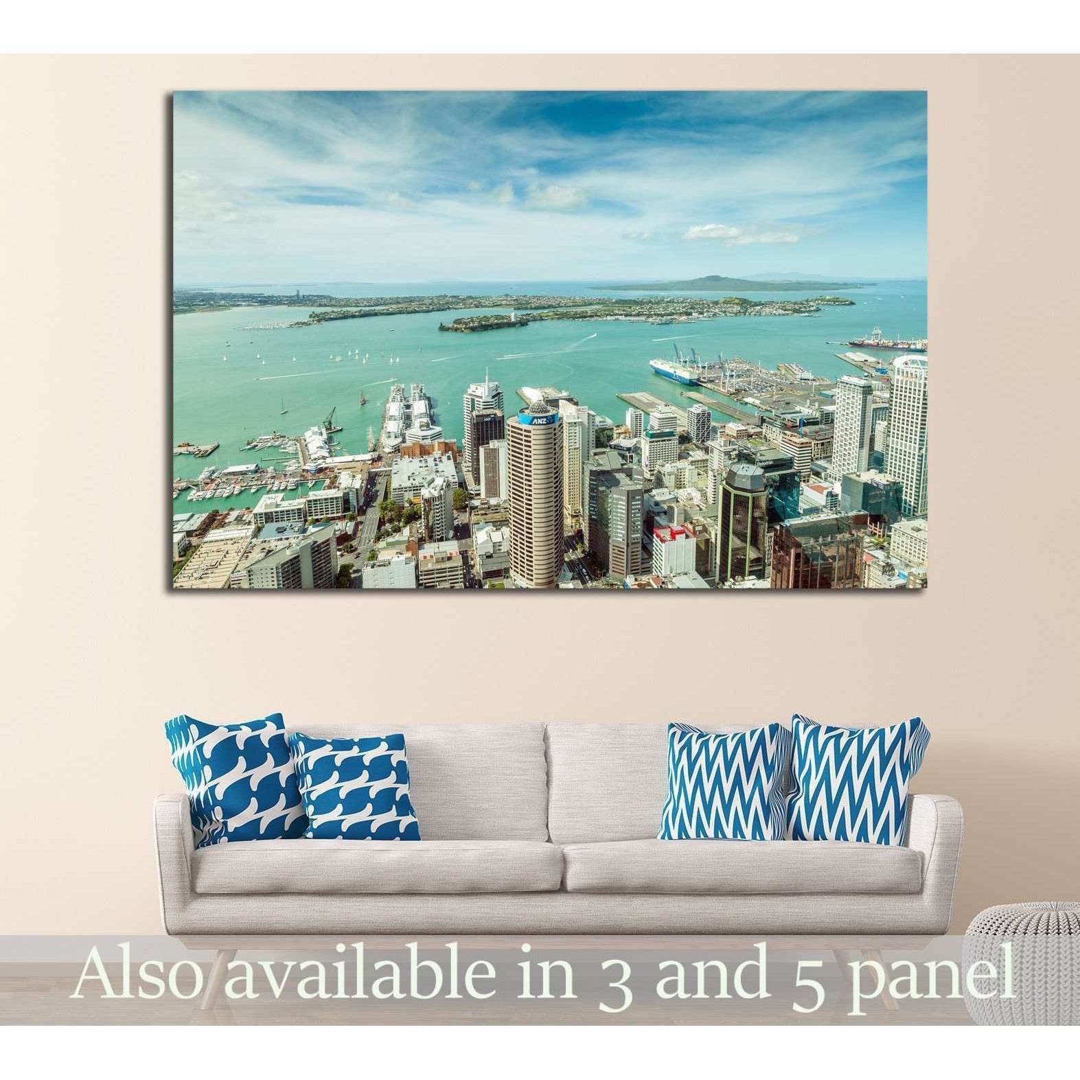 Auckland skyline and turquoise harbour canvas print hung above a sofa in a modern living room