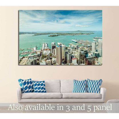 Auckland skyline and turquoise harbour canvas print hung above a sofa in a modern living room