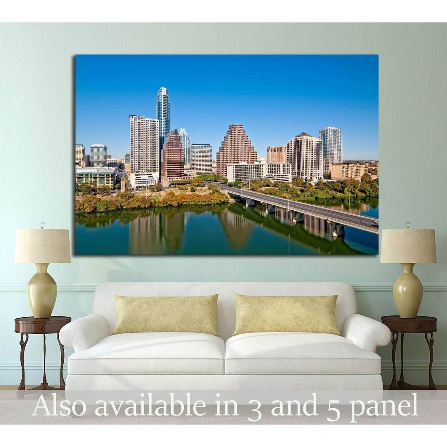 Austin skyline canvas print with downtown towers, bridge, and river above a sofa