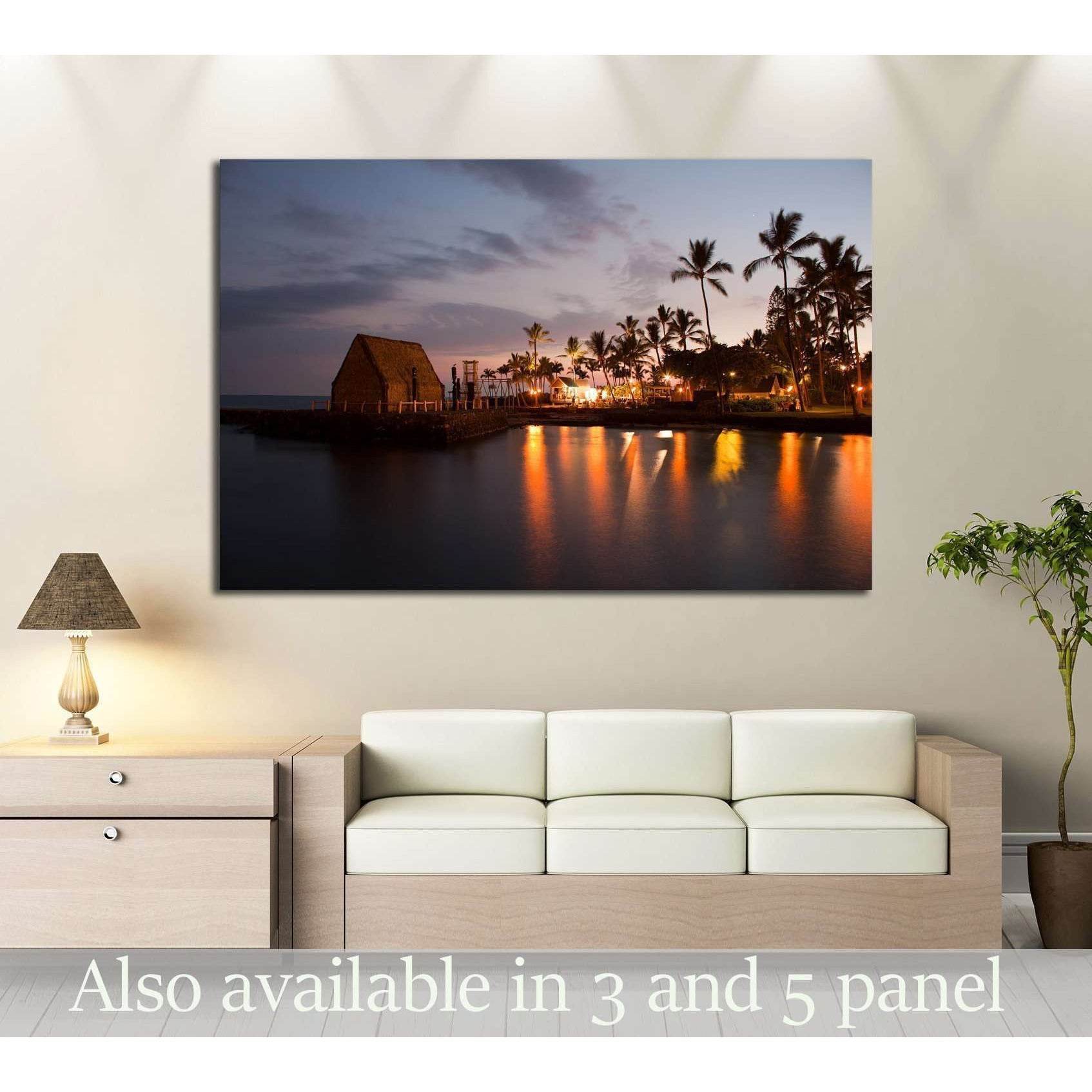 Hawaii luau canvas print with palm trees, tiki lights, and sunset reflections above a sofa