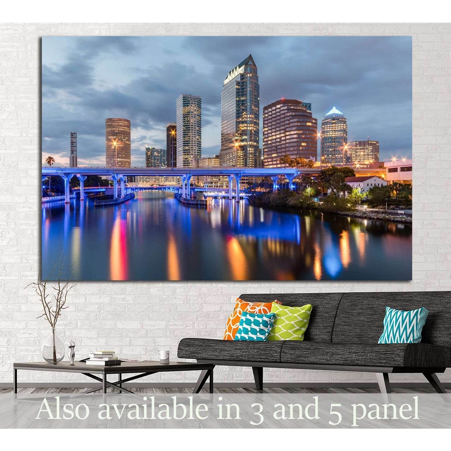Tampa skyline canvas print with blue-lit bridge and river reflections above sofa in modern living room