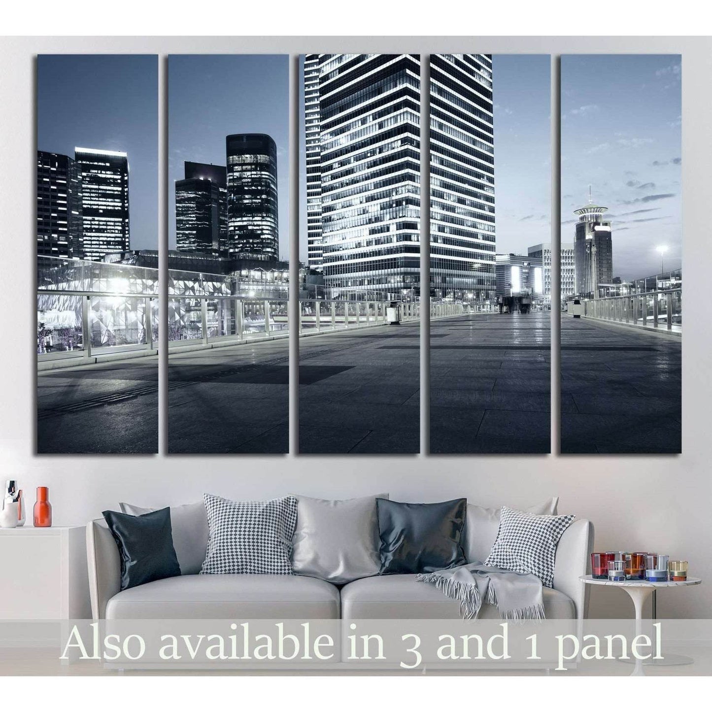 Shanghai skyline canvas print with blue-gray skyscrapers at night above a sofa in a modern living room
