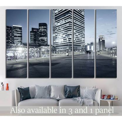 Shanghai skyline canvas print with blue-gray skyscrapers at night above a sofa in a modern living room