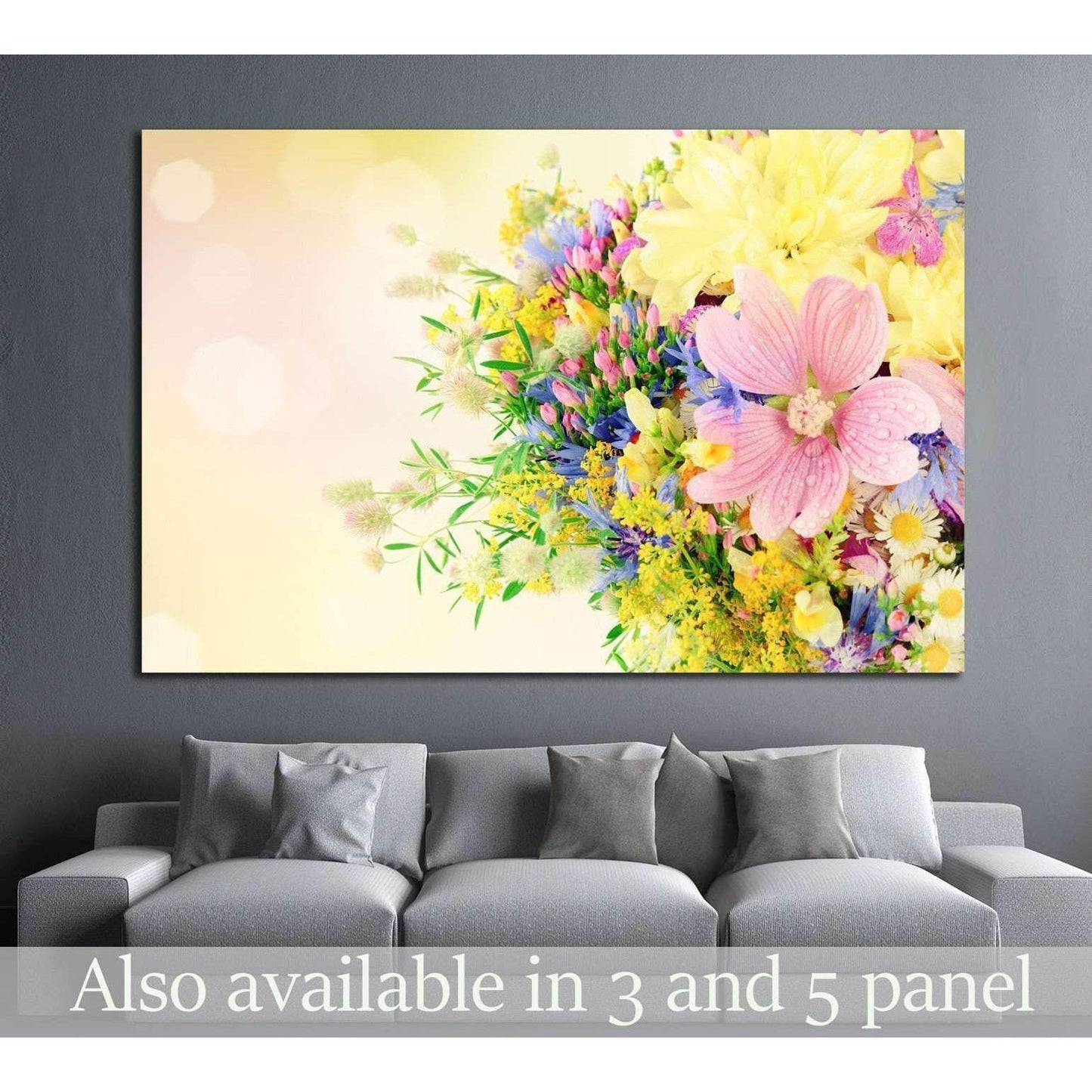 Summer bouquet canvas print with pink, yellow, and blue flowers above a gray sofa