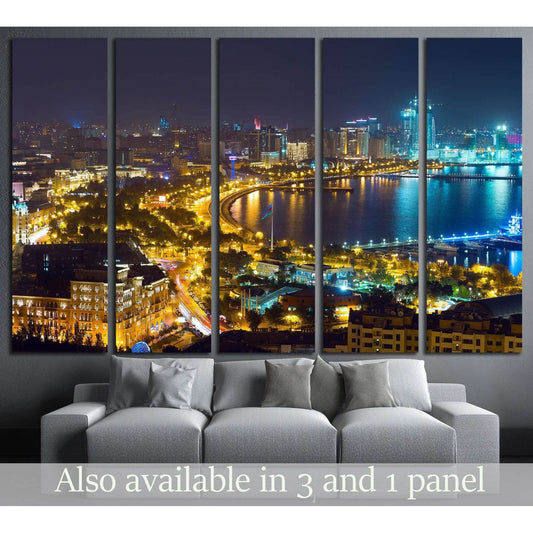 Baku skyline canvas print with illuminated waterfront and city lights at night above a sofa