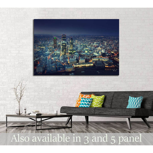 City of London skyline canvas print at dusk displayed above a sofa in a modern living room