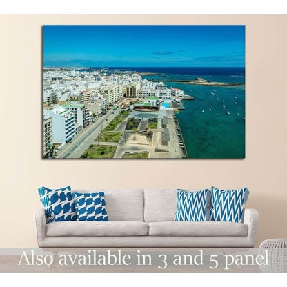 Arrecife Lanzarote coastal cityscape canvas print hung above a sofa in a modern living room