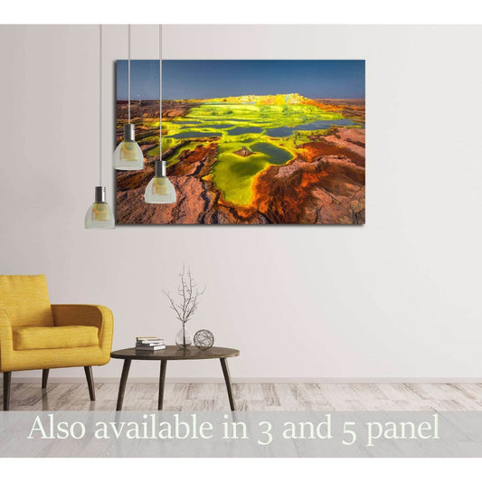 Sulphur Springs of Dalol Volcano Artwork for Nature Inspired DecorThis canvas print vividly captures the Dalol volcano in Ethiopia, known for its surreal, otherworldly landscapes. The rich, warm hues of the terrain contrast with the vivid acidic pools, ma