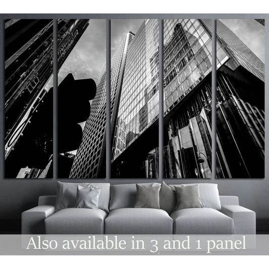 Black and white Hong Kong skyscraper canvas print with dramatic upward view in a modern living room