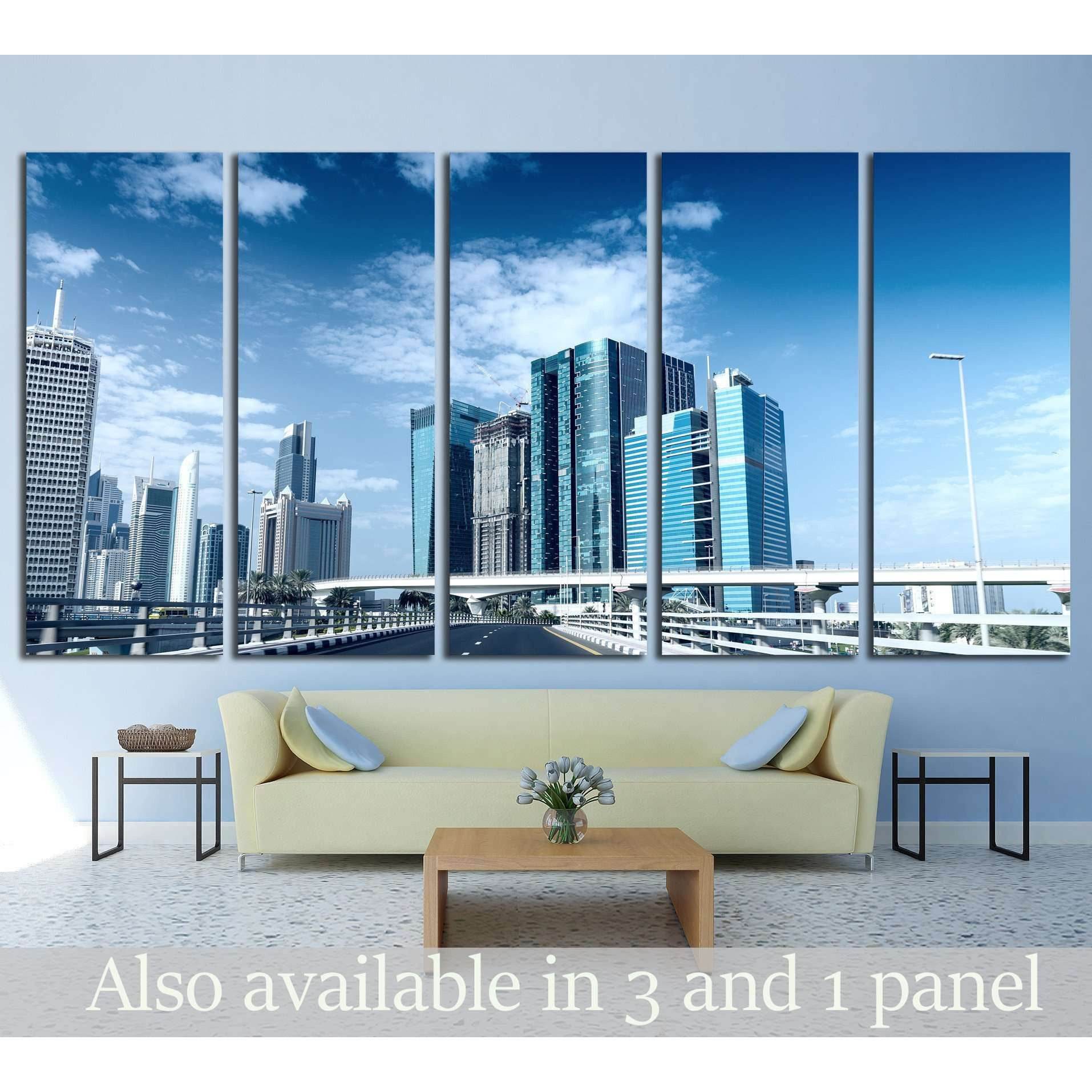 Dubai downtown skyscrapers and elevated highway multi-panel canvas print above sofa