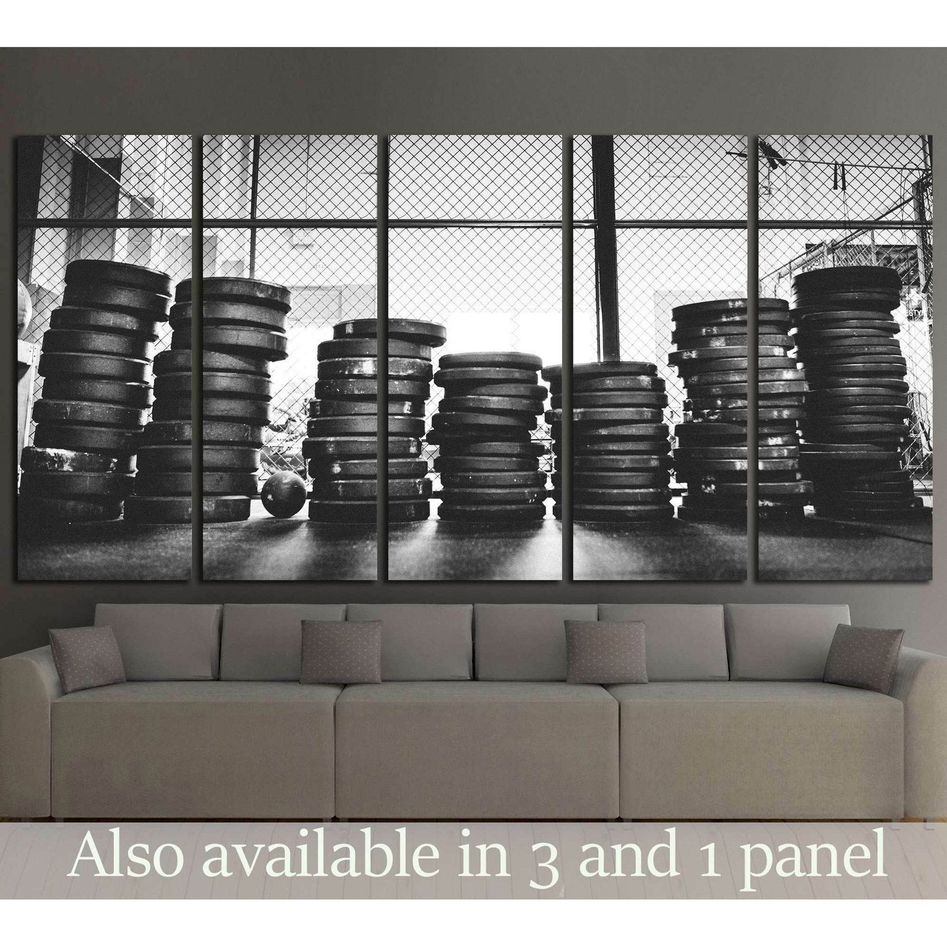 Black and white weight plates canvas print with stacked gym discs in front of industrial windows