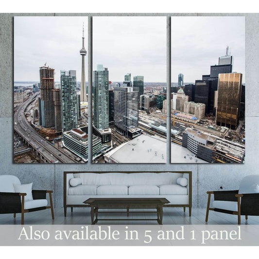 Toronto skyline triptych canvas print with CN Tower and downtown high-rises above a sofa