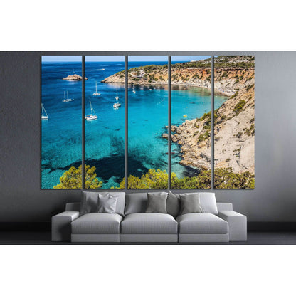 Es Vedra Island Canvas Print - Serene Mediterranean Seascape ArtThis canvas print captures the serene beauty of Es Vedra Island, located off the coast of Ibiza, Spain. The clear, turquoise waters, dotted with leisure boats and framed by rugged cliffs, evo