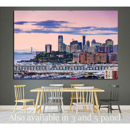 Jersey City skyline canvas print with pink sunset sky above the waterfront, displayed in a modern dining room