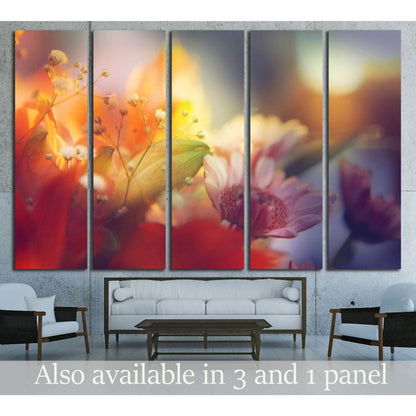Soft-focus floral abstract canvas print with pink orange and violet blooms above a sofa