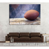 Football on old ages wood table and studio tan and blue back drop №2114 Ready to Hang Canvas Print