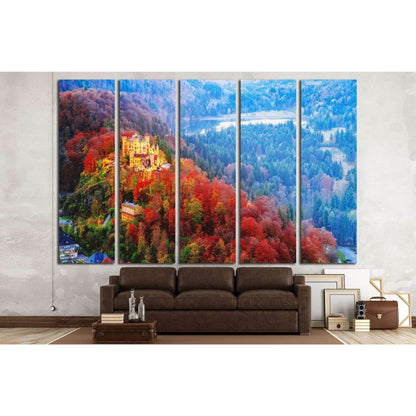 Hohenschwangau castle, Germany, Bavaria region №1811 Ready to Hang Canvas PrintThis canvas print showcases a vibrant autumnal landscape with a majestic castle nestled among richly hued trees. The warm reds and oranges of the foliage create a striking cont
