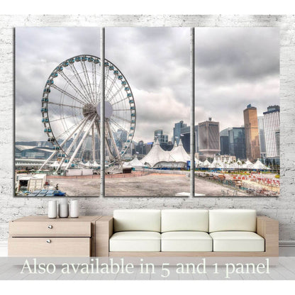 Hong Kong skyline canvas print with Central Pier Ferris wheel above a sofa in a modern living room