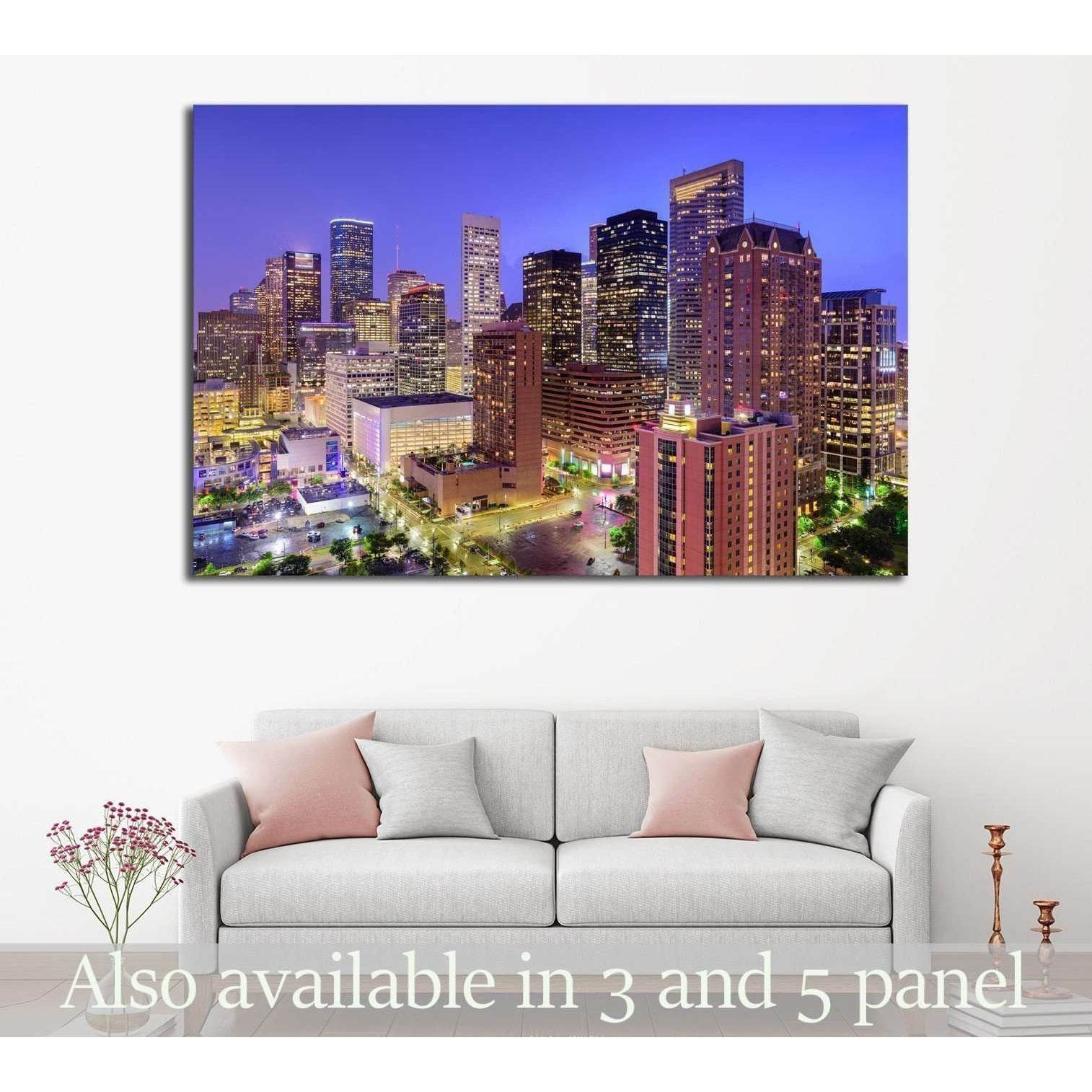 Houston skyline canvas print hung above a sofa in a modern living room with downtown towers at dusk