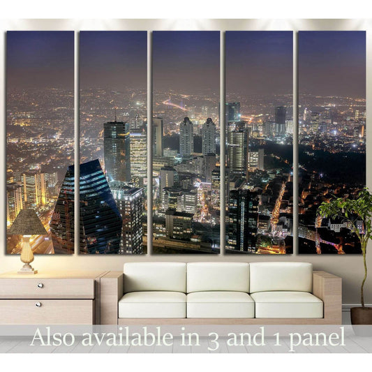 Istanbul skyline canvas print with glowing night city lights above sofa in a modern living room