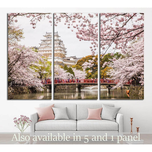Himeji Castle and Cherry Blossoms Canvas Print for Cultural DecorThis canvas print beautifully captures Himeji Castle, one of Japan's most renowned castles, framed by the delicate pink blossoms of sakura trees. The vibrant scene is enriched by the presenc