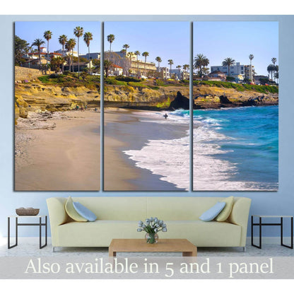 La Jolla San Diego beach canvas print with palm trees, sandy cliffs, and turquoise waves above a sofa