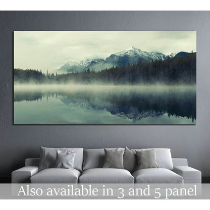 Lake Herbert, Banff National Park, Canada №877 Ready to Hang Canvas PrintThis serene canvas print captures Lake Herbert in Banff National Park, enveloped in mist, with majestic mountains mirrored on the still water. Ideal as wall art, this artwork brings
