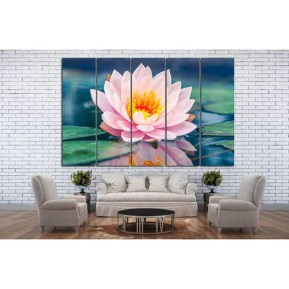 Zen Lotus Flower Artwork for Calming Meditation RoomsThis canvas print beautifully showcases a close-up of a pink lotus flower in full bloom, with its reflection gently mirrored on the water's surface. The image exudes a sense of purity and calm, making i