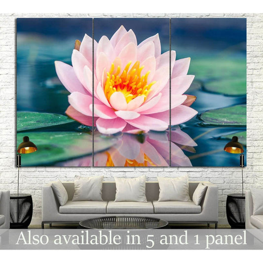 Zen Lotus Flower Artwork for Calming Meditation RoomsThis canvas print beautifully showcases a close-up of a pink lotus flower in full bloom, with its reflection gently mirrored on the water's surface. The image exudes a sense of purity and calm, making i