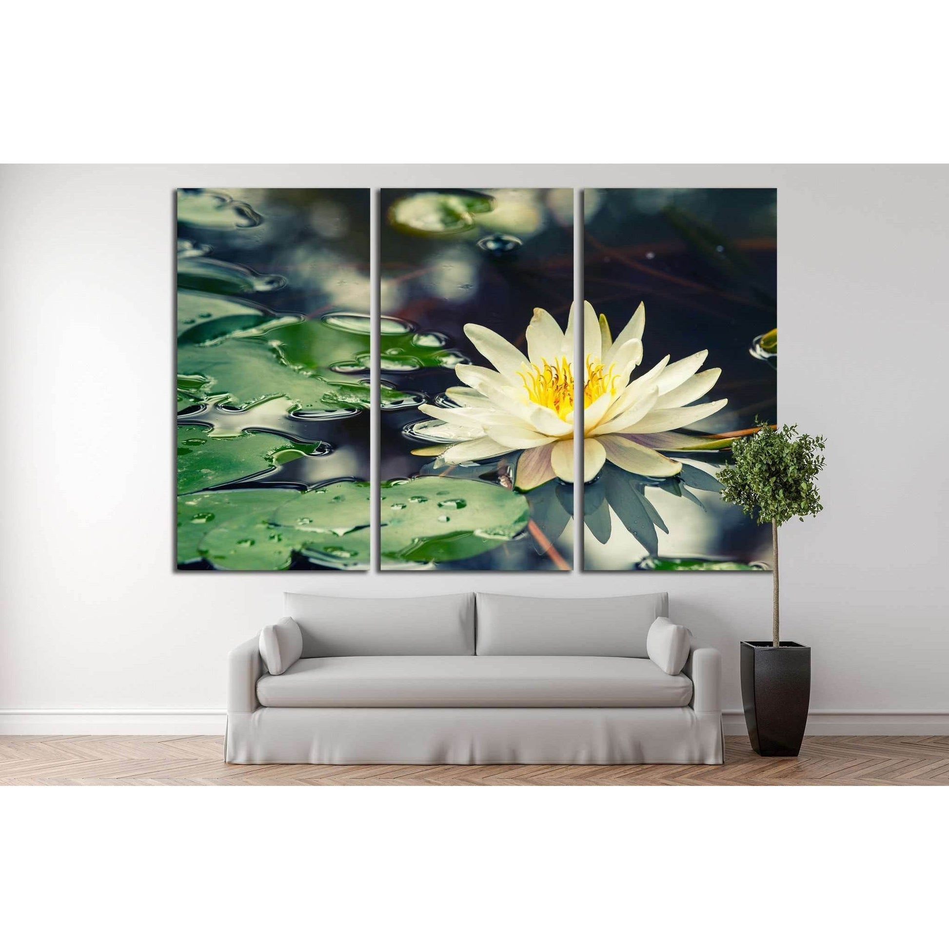 Serene Water Lily Canvas Print for Spa-Like Bathroom DecorThis canvas print depicts a serene water lily, its white and yellow bloom contrasting beautifully with the dark, reflective pond and the lush green lily pads. It's a piece that evokes tranquility a