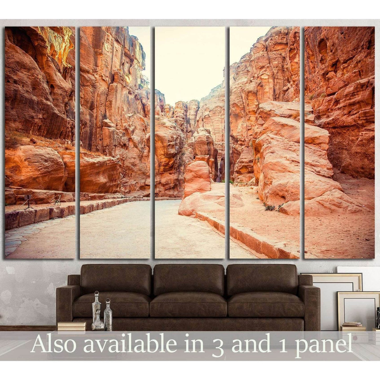 Five-panel ancient city canvas print showing a sunlit sandstone canyon passage above a brown sofa