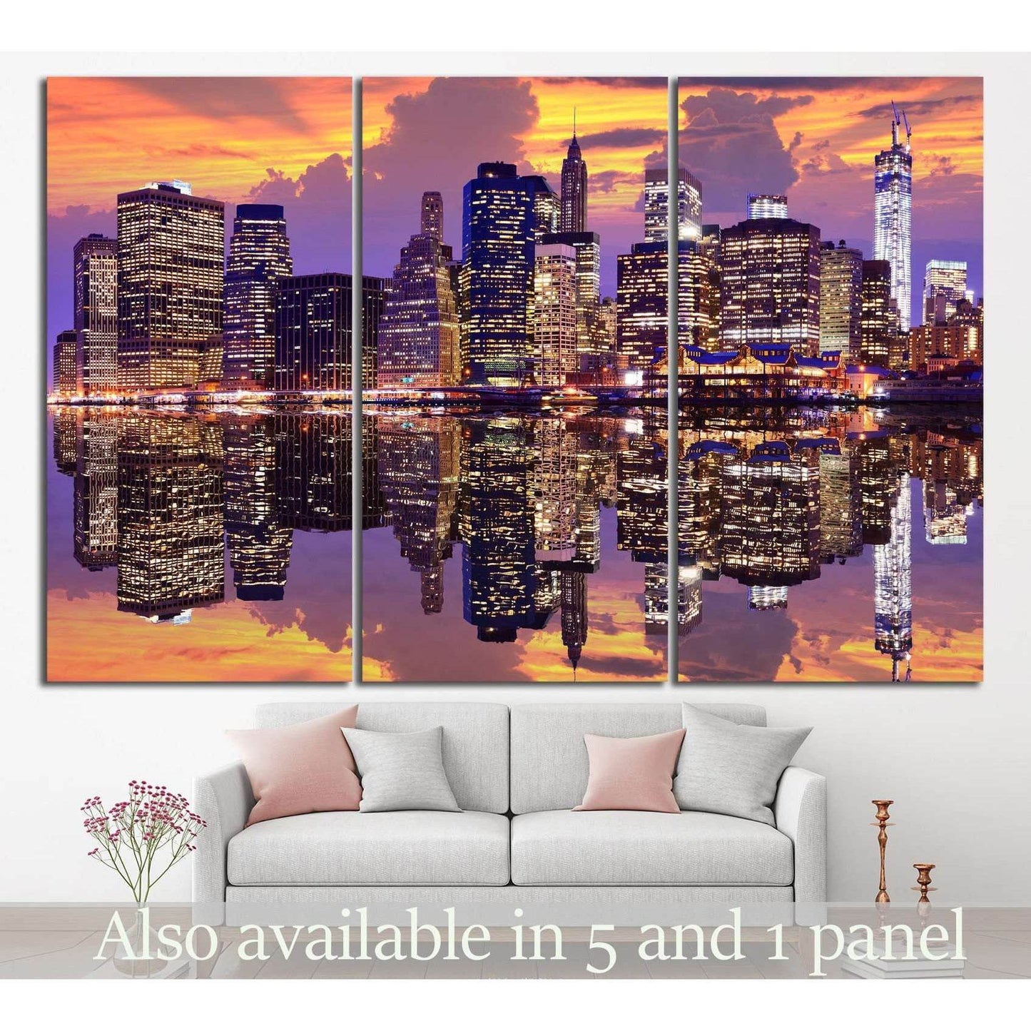 Manhattan skyline triptych canvas print with sunset reflections above sofa in modern living room