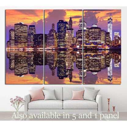 Manhattan skyline triptych canvas print with sunset reflections above sofa in modern living room