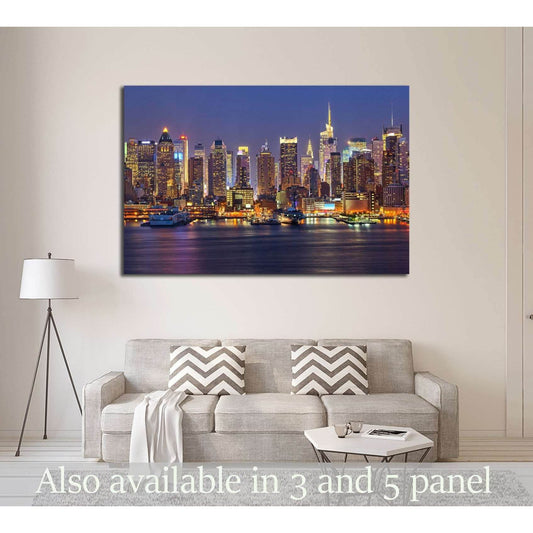 New York skyline canvas print above a sofa in a modern living room with glowing city lights