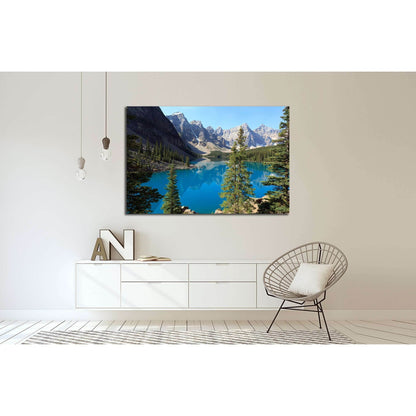 Moraine Lake Banff National Park Canvas Print - Pristine Wilderness Wall ArtThis canvas print showcases the breathtaking view of Moraine Lake in the Valley of the Ten Peaks, located in Banff National Park, Canada. The brilliant turquoise waters of the gla