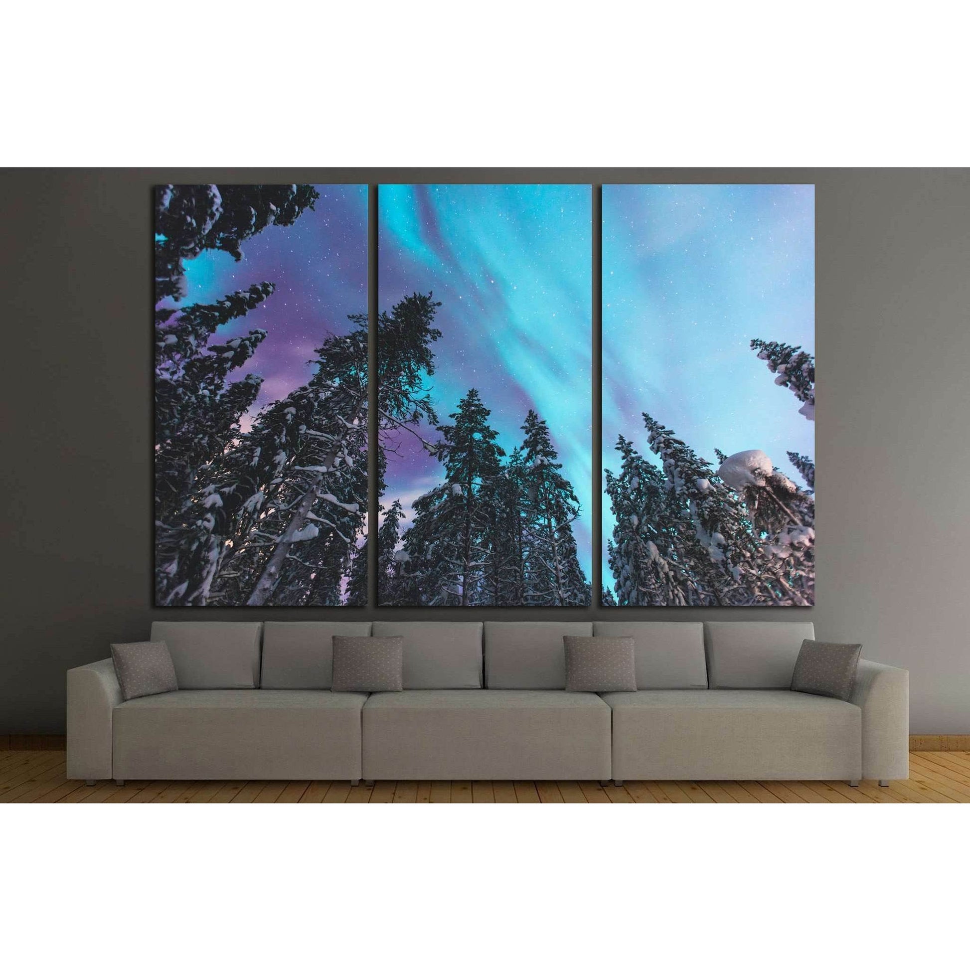 Cosmic Dance of Northern Lights Artwork for Boutique Hotel DecorThis canvas print artfully depicts the Northern Lights dancing over a forest of pine trees, with the cosmic palette of blues and purples set against the dark silhouettes of the trees. It is a