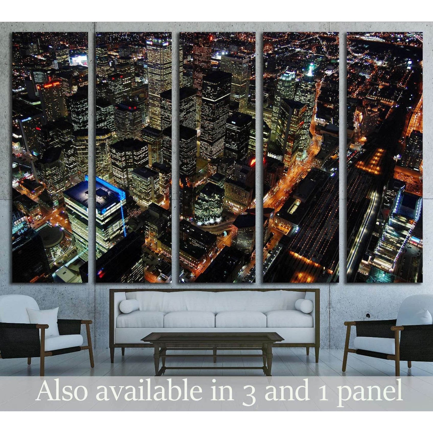 Toronto skyline canvas print with aerial night view of downtown towers above a modern living room sofa