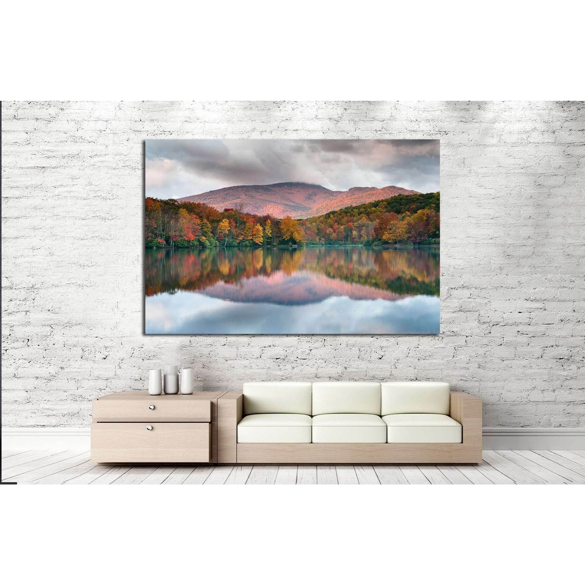 Blue Ridge Parkway Autumnal Mountain View Canvas Art for Modern OfficesThis canvas print depicts a peaceful lake reflecting the fiery hues of autumn trees and the soft purple of the mountain backdrop. The mirrored colors in the water create a sense of har