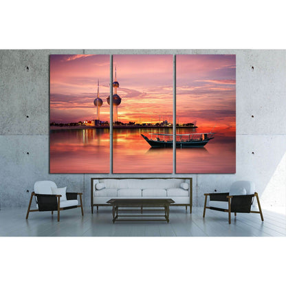 Serene Sunset Over Kuwait Towers Canvas for Office WallsThis canvas print showcases a serene twilight scene with the iconic Kuwait Towers silhouetted against a radiant sunset sky, complemented by a traditional dhow boat on the water's calm surface. This p